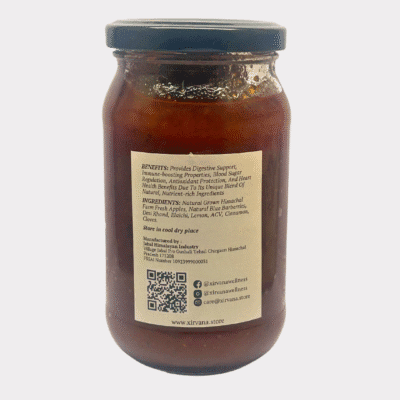 Rich, amber-colored Apple Barberry Spread in a glass jar, showcasing the vibrant blend of Himalayan apples and blue barberries